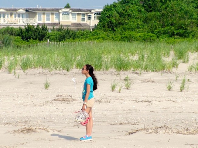 Alex finds a deflated balloon on a plover beach